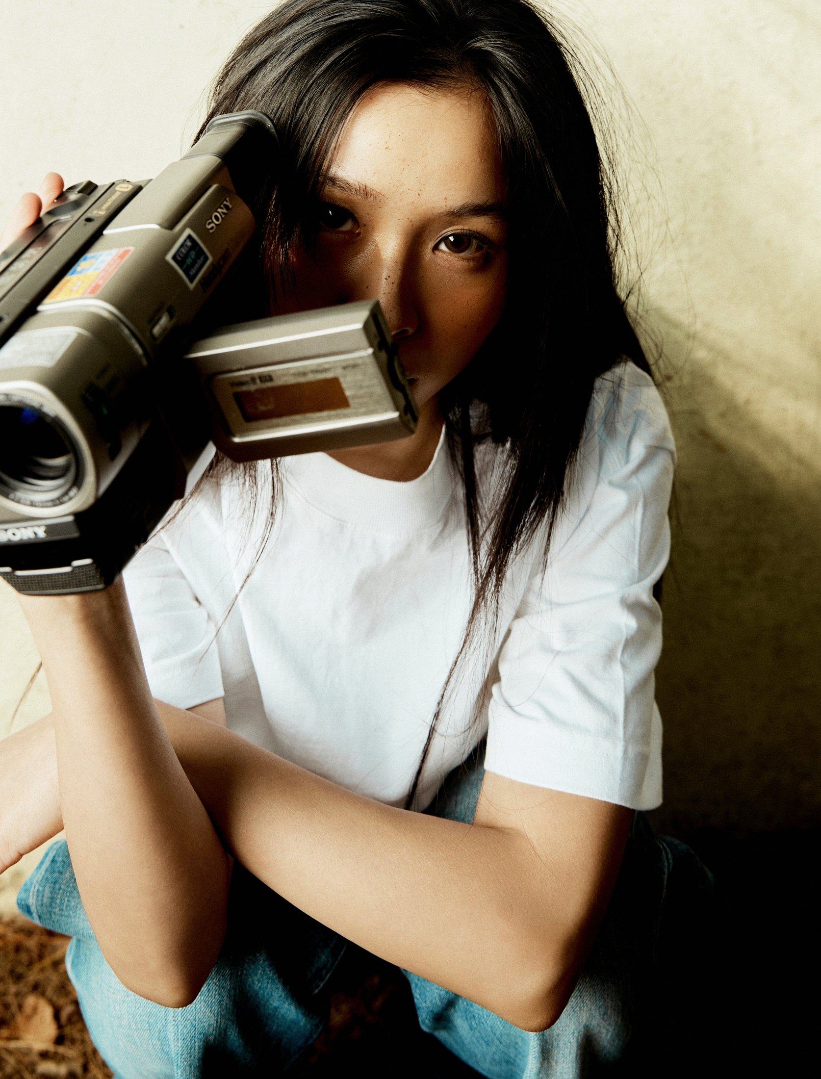 SUZIE VROWN holding a camcorder