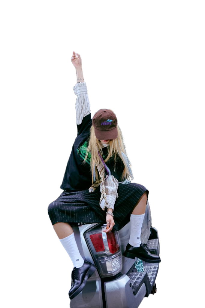 SUZIE VROWN sitting on the back of a car with one arm raised