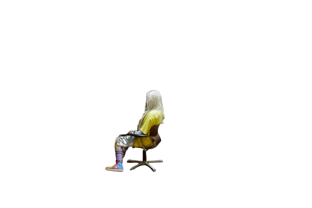 SUZIE VROWN seated sideways on a chair